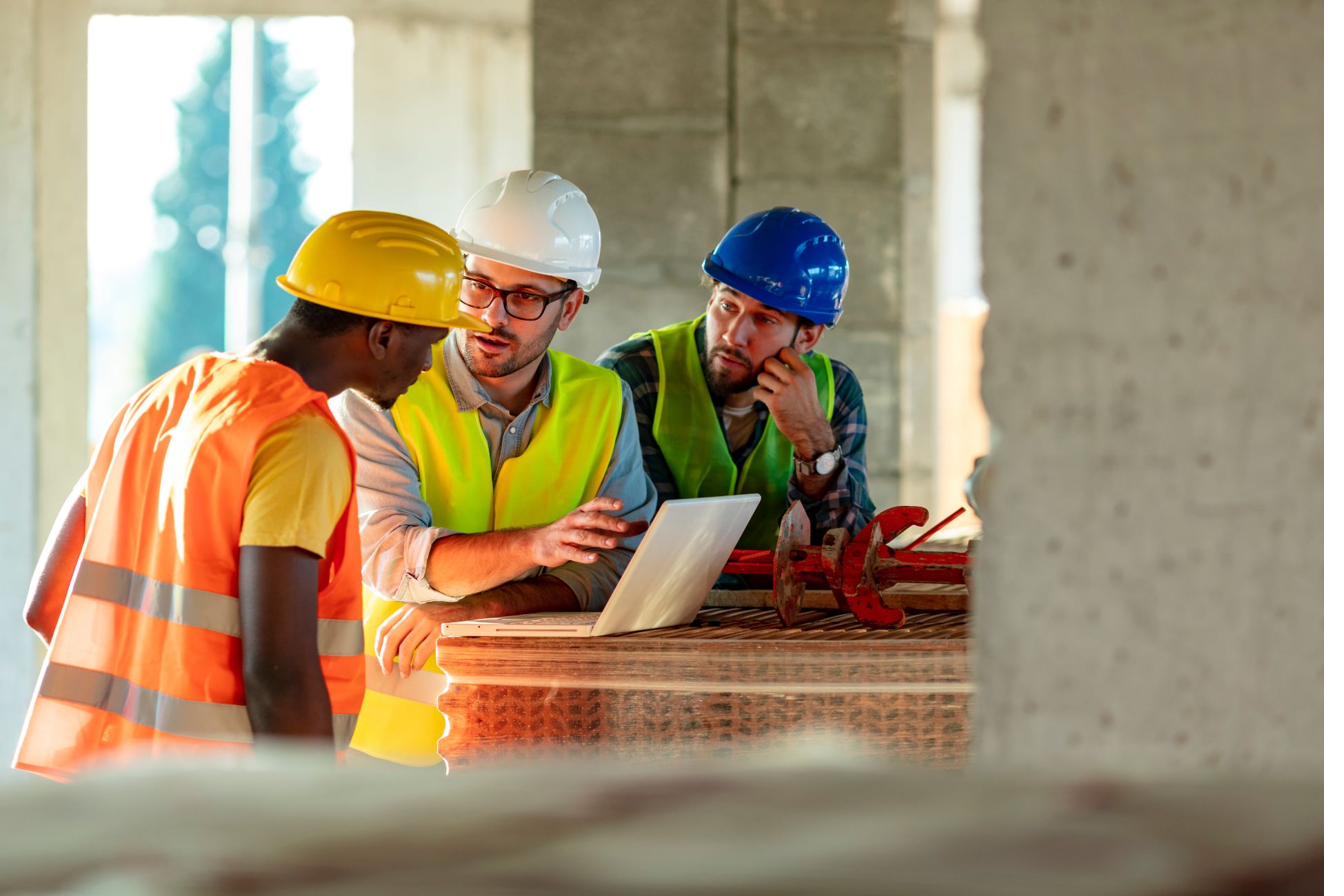 Construction professionals collaborating on jobsite